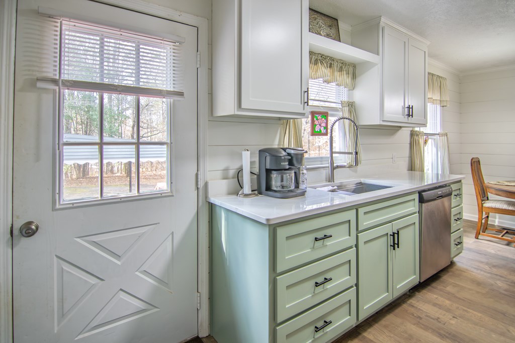 10933 Us Highway Hamilton, GA 31811 - Photo 18 of 44 a kitchen with a sink cabinets and window
