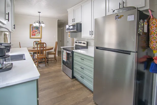 a kitchen with kitchen island granite countertop lots of counter top space
