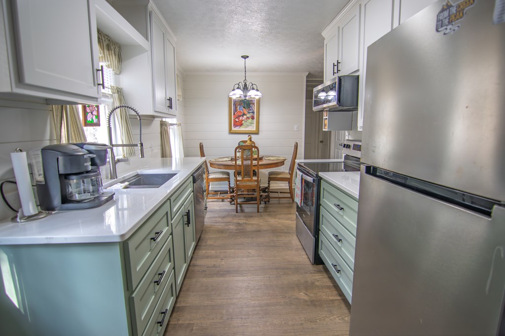 10933 Us Highway Hamilton, GA 31811 - Photo 20 of 44 a kitchen with kitchen island granite countertop lots of counter top space