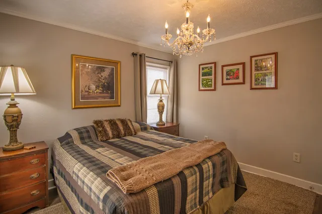 a bathroom with a sink mirror vanity and toilet
