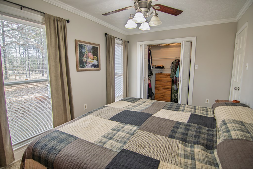 10933 Us Highway Hamilton, GA 31811 - Photo 30 of 44 a bedroom with a large bed and a window