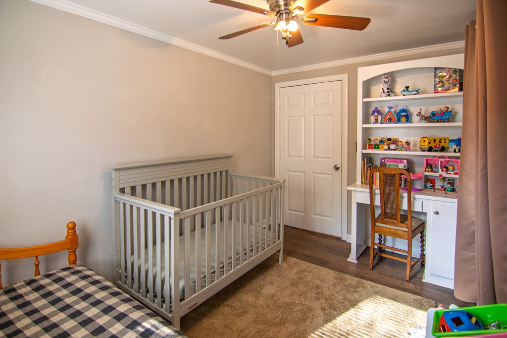 10933 Us Highway Hamilton, GA 31811 - Photo 32 of 44 a bedroom with furniture and a window