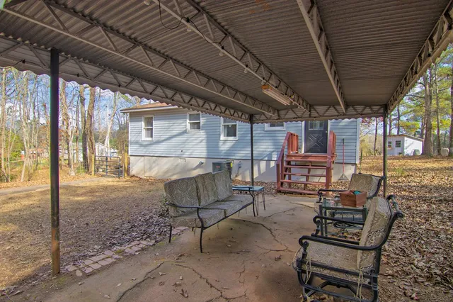 a view of a room with furniture and front door