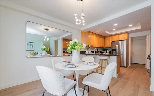 a view of a dining room with furniture and chandelier