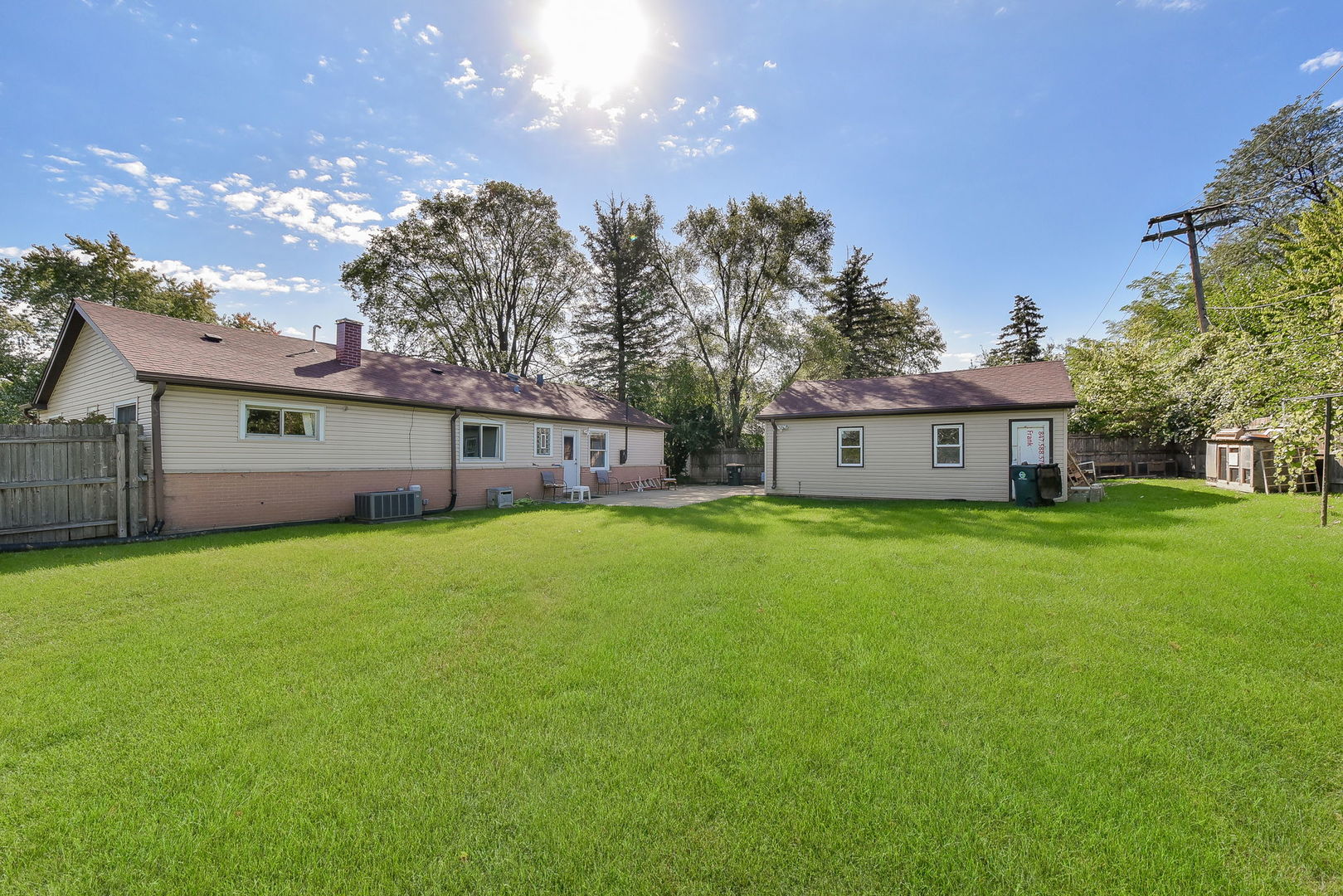 850 Ash Road Hoffman Estates, IL 60169 - Photo 16 of 16 a front view of house with yard and trees in the background