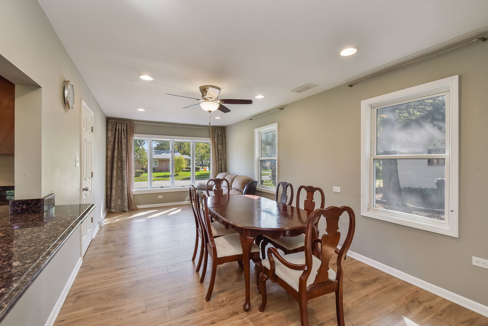850 Ash Road Hoffman Estates, IL 60169 - Photo 5 of 16 a view of a dining room with furniture window and wooden floor