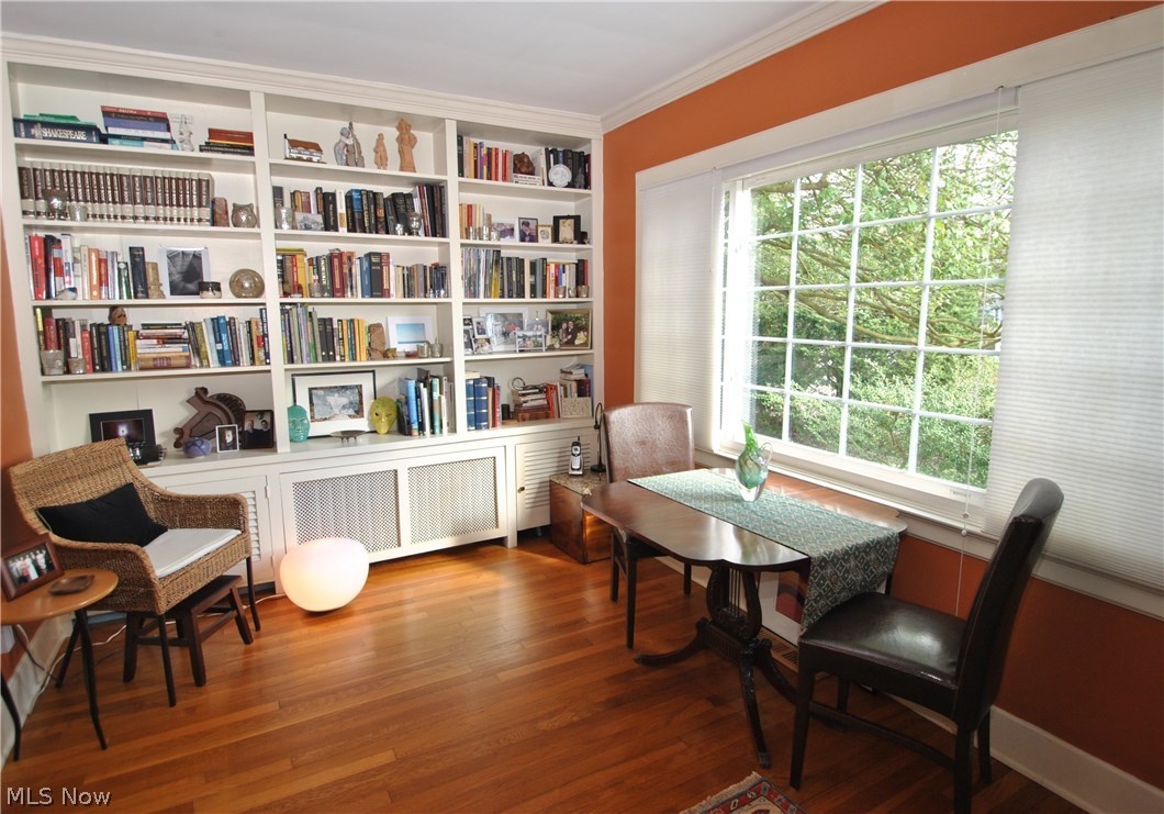 2881 Bellaire Road Silver Lake, OH 44224 - Photo 7 of 29 A wall of bookcases and large picture window are featured in the first floor library. There's also a door leading to the private screened porch.