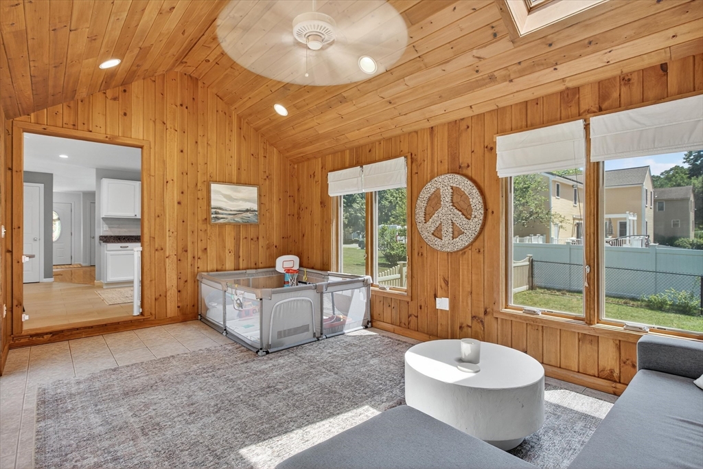 34 Timberline Road Millis, MA 02054 - Photo 13 of 42 a living room with furniture a table and large windows