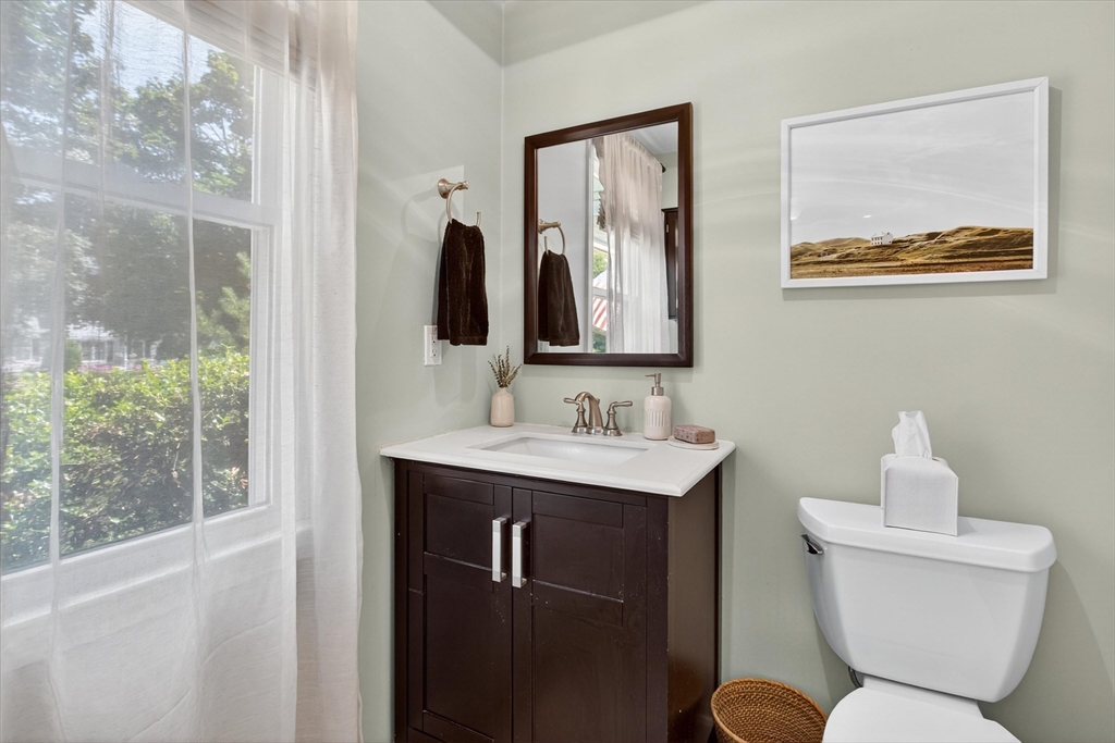 34 Timberline Road Millis, MA 02054 - Photo 16 of 42 a bathroom with a toilet sink and mirror