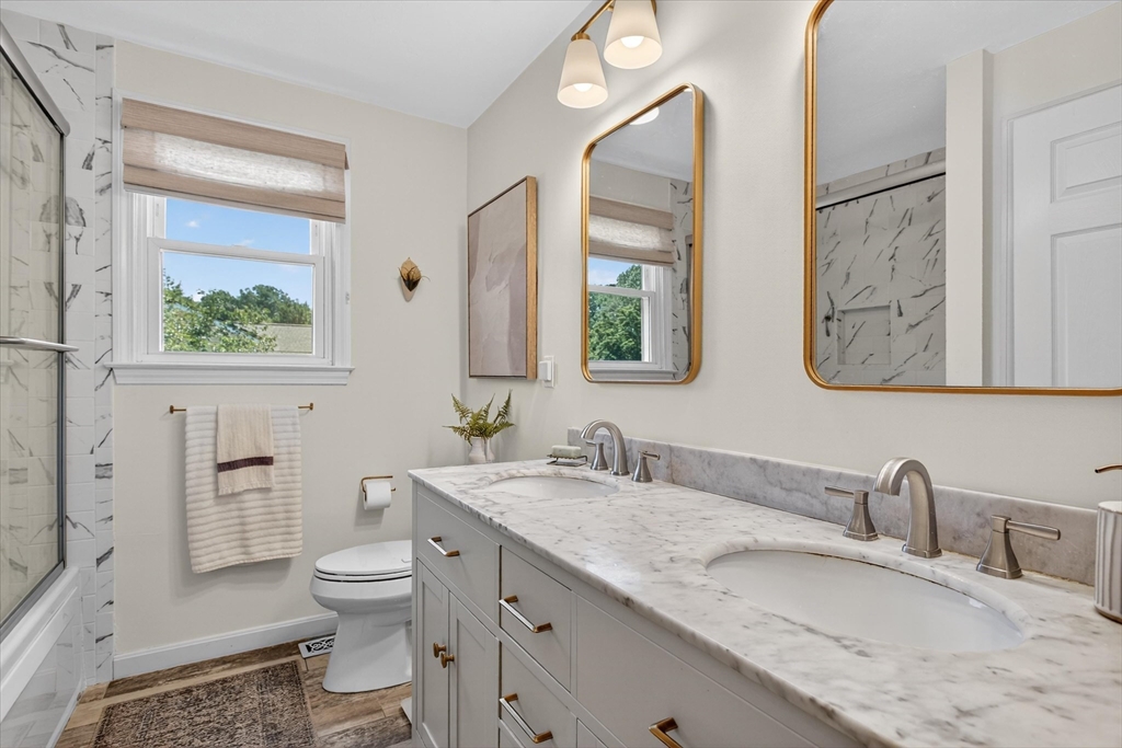 34 Timberline Road Millis, MA 02054 - Photo 22 of 42 a bathroom with a granite countertop sink mirror vanity and toilet