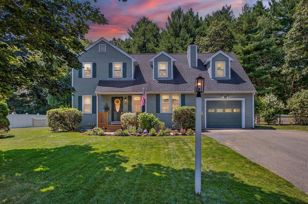 34 Timberline Road Millis, MA 02054 - Photo 39 of 42 a front view of a house with a yard and garage