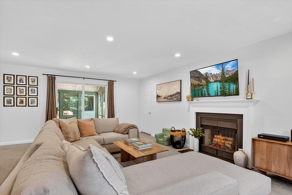 34 Timberline Road Millis, MA 02054 - Photo 5 of 42 a living room with furniture fireplace and window