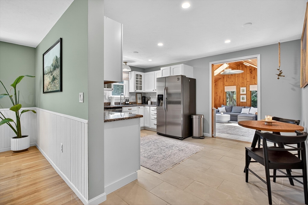 34 Timberline Road Millis, MA 02054 - Photo 8 of 42 a kitchen with refrigerator and chairs