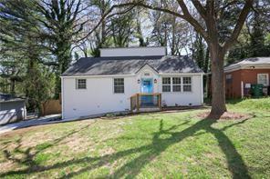 2074 Dellwood Place Decatur, GA 30032 - Photo 1 of 1 a front view of house with yard and trees in the background