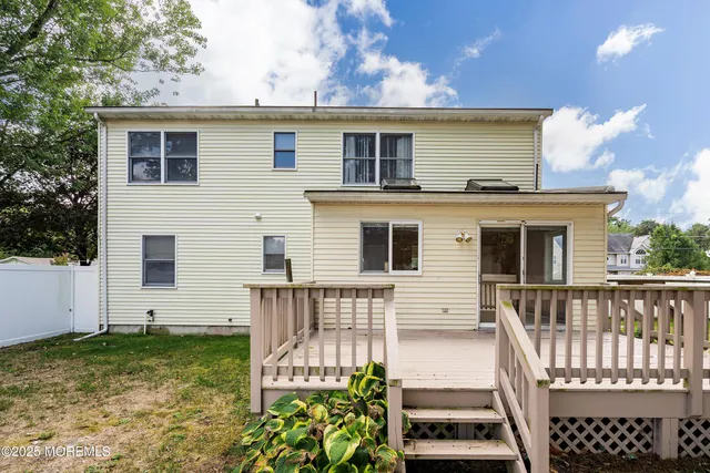 a view of house with a yard