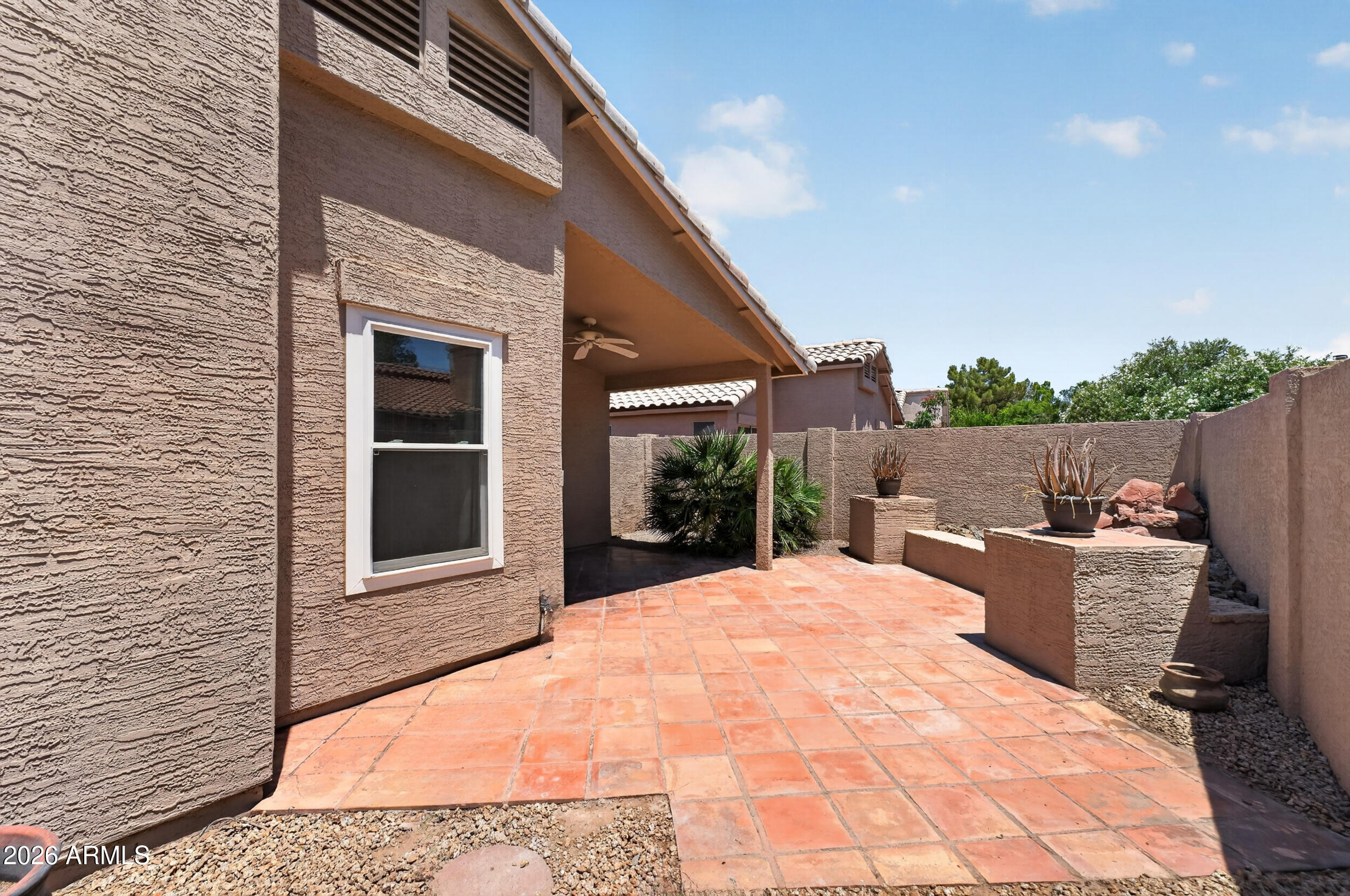 4729 West Monterey Street Chandler, AZ 85226 - Photo 10 of 50 a view of house and yard with wooden fence