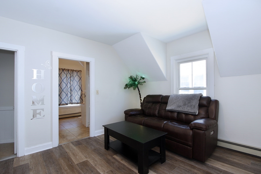 2 High Street Middleboro, MA 02346 - Photo 30 of 41 a living room with furniture and a potted plant