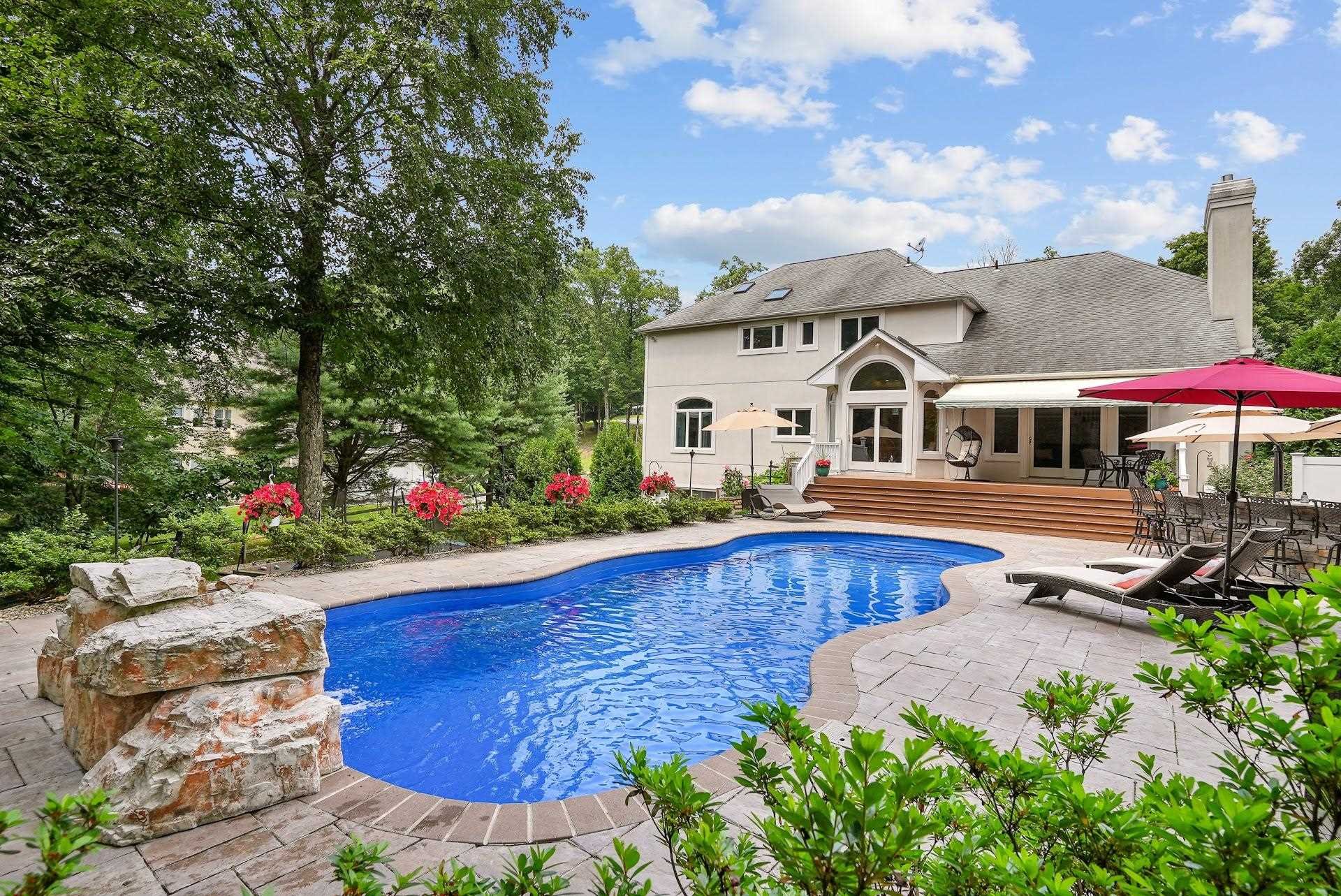 67 Greenwich Avenue Central Valley, NY 10917 - Photo 2 of 30 a view of a house with swimming pool and sitting area