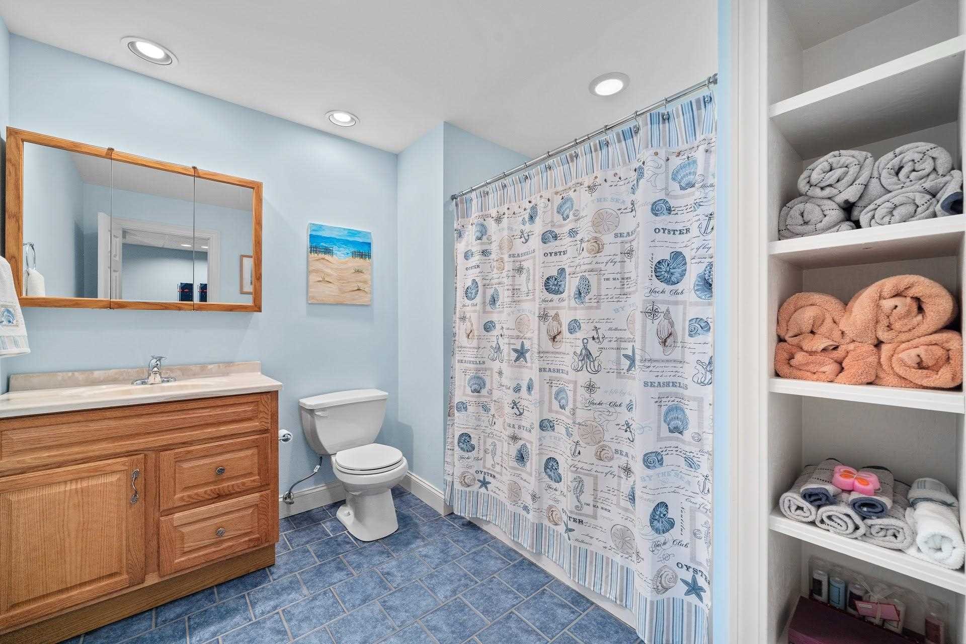 67 Greenwich Avenue Central Valley, NY 10917 - Photo 16 of 30 a bathroom with a toilet sink vanity and mirror