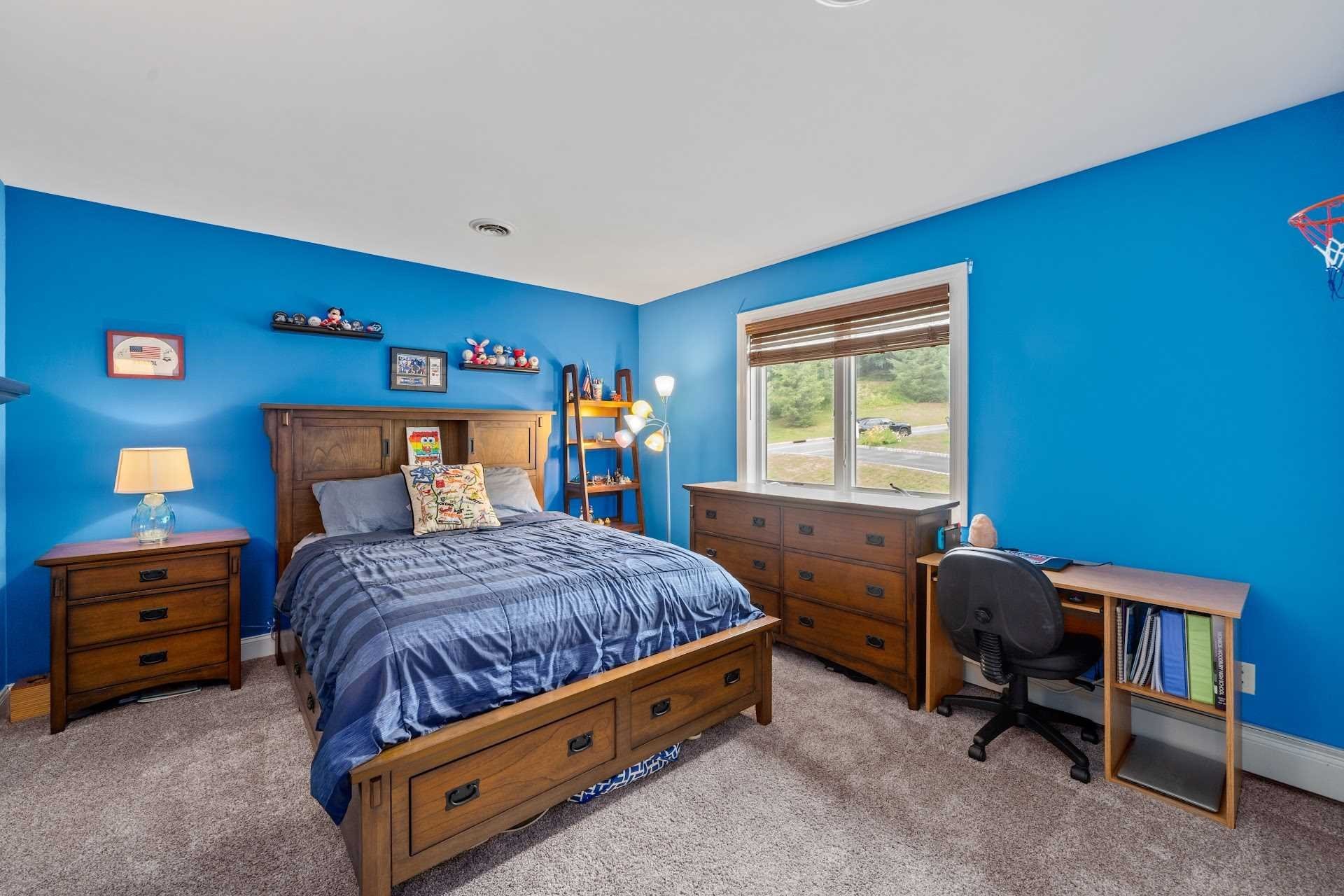 67 Greenwich Avenue Central Valley, NY 10917 - Photo 17 of 30 a bedroom with a bed and a table chair