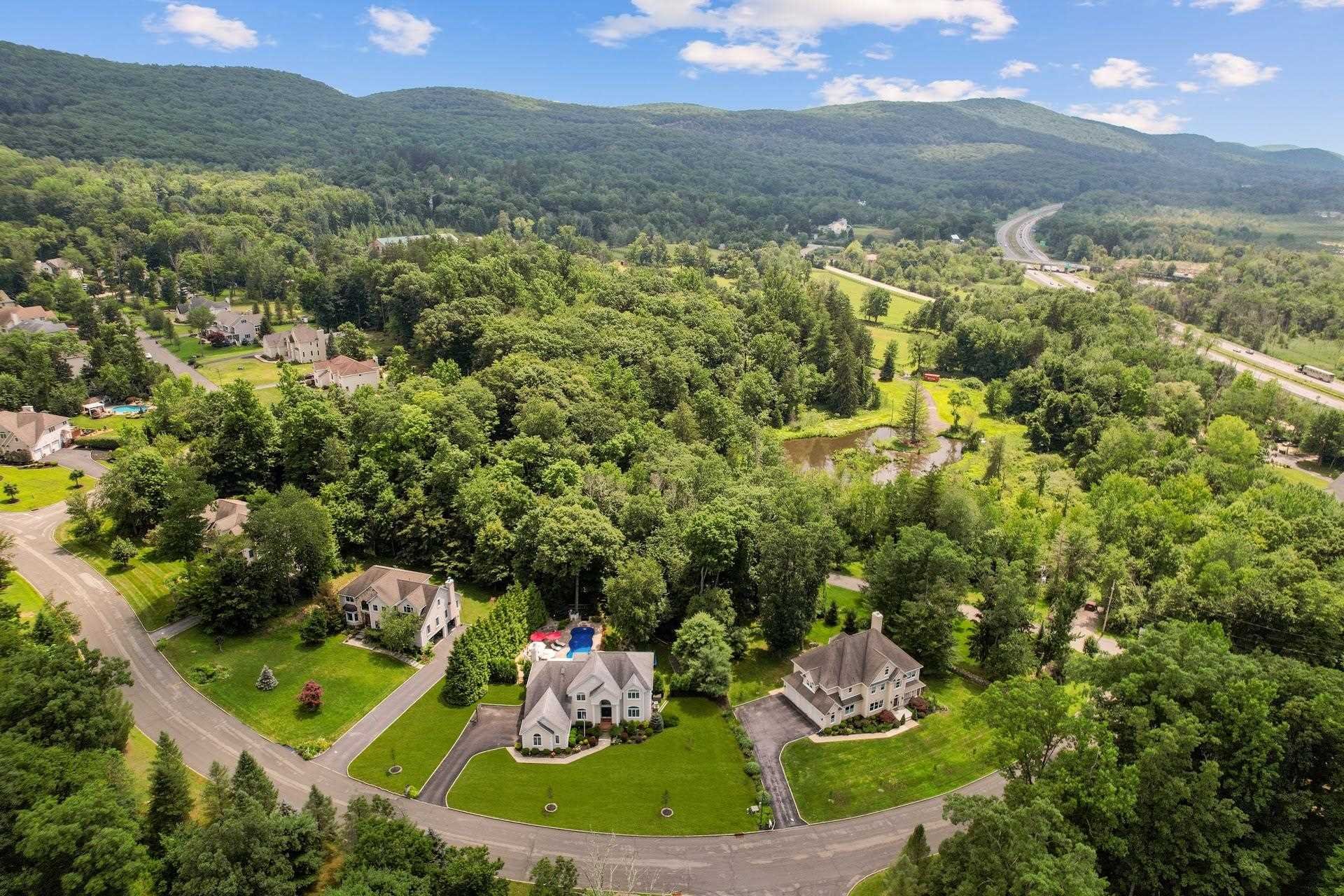 67 Greenwich Avenue Central Valley, NY 10917 - Photo 29 of 30 a view of a houses with a yard and lake