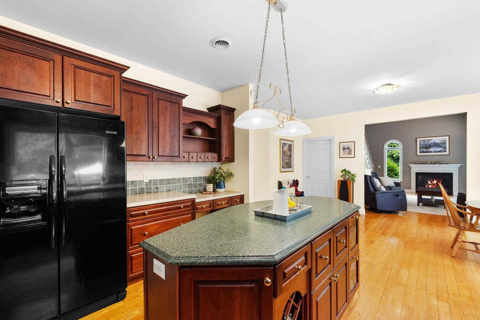 67 Greenwich Avenue Central Valley, NY 10917 - Photo 5 of 30 a kitchen with stainless steel appliances granite countertop a sink a kitchen island a stove and a refrigerator