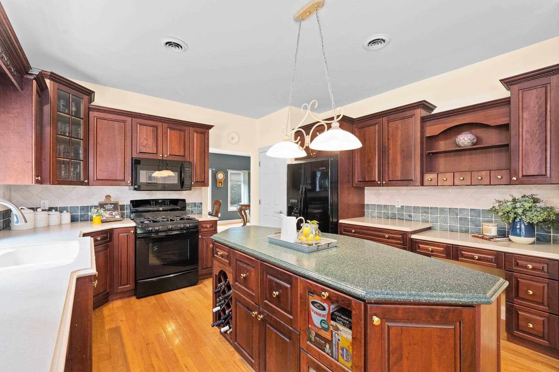 67 Greenwich Avenue Central Valley, NY 10917 - Photo 6 of 30 a kitchen with stainless steel appliances granite countertop a sink stove and refrigerator