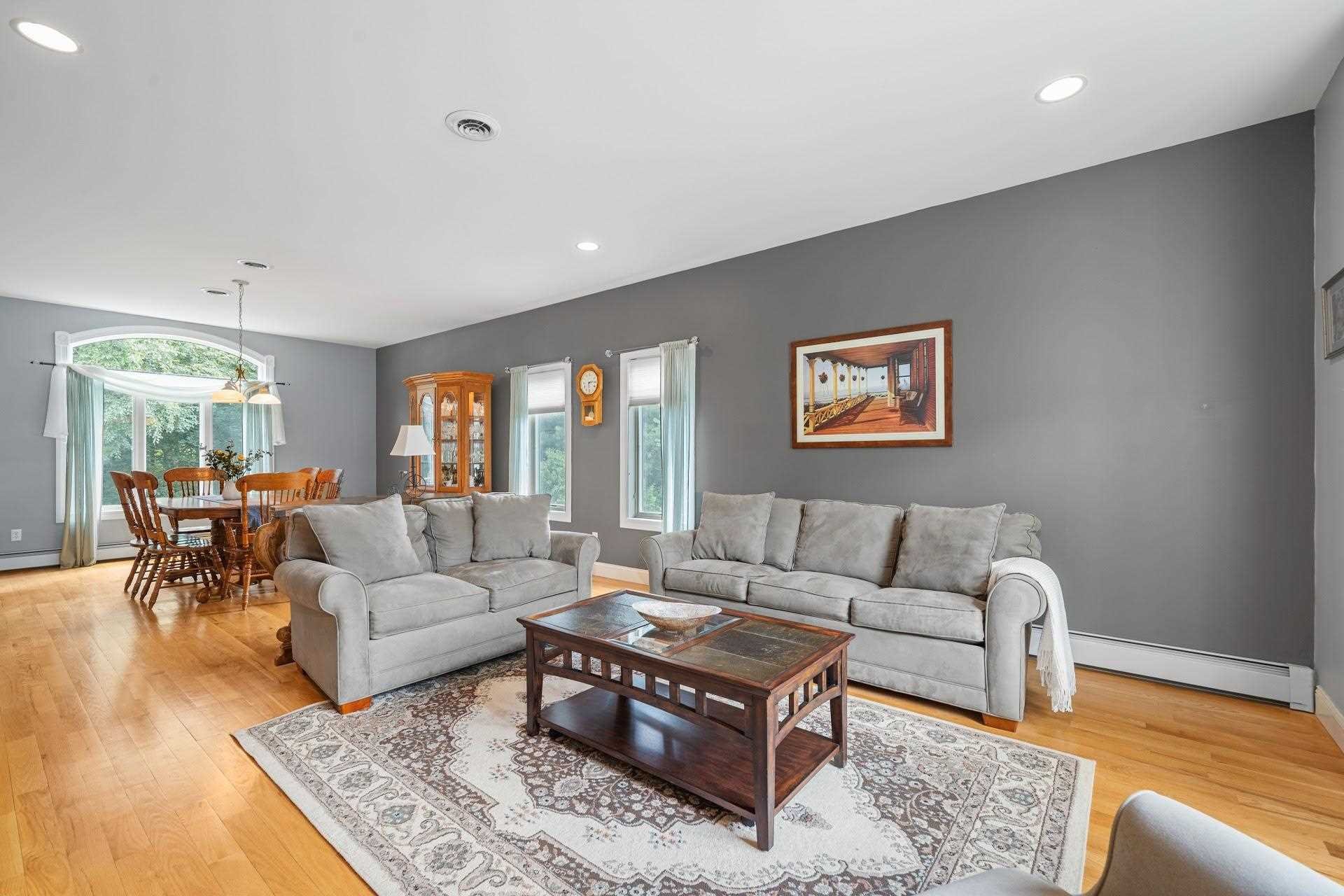67 Greenwich Avenue Central Valley, NY 10917 - Photo 8 of 30 a living room with furniture potted plant and a table