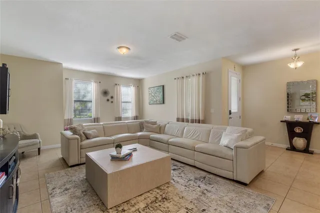 a living room with furniture and a couch