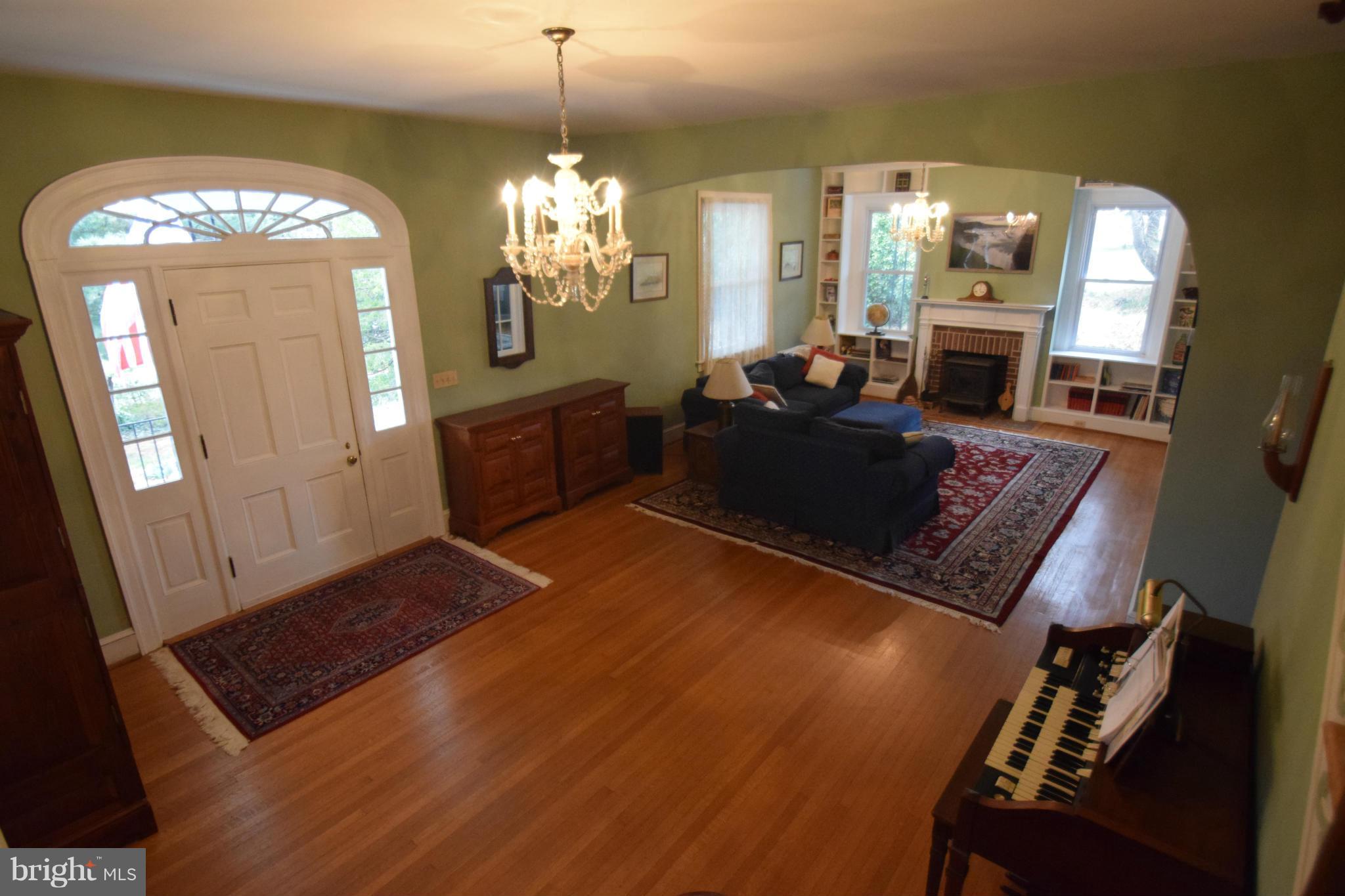 601 Charing Cross Road Baltimore, MD 21229 - Photo 6 of 30 a living room with furniture and a chandelier