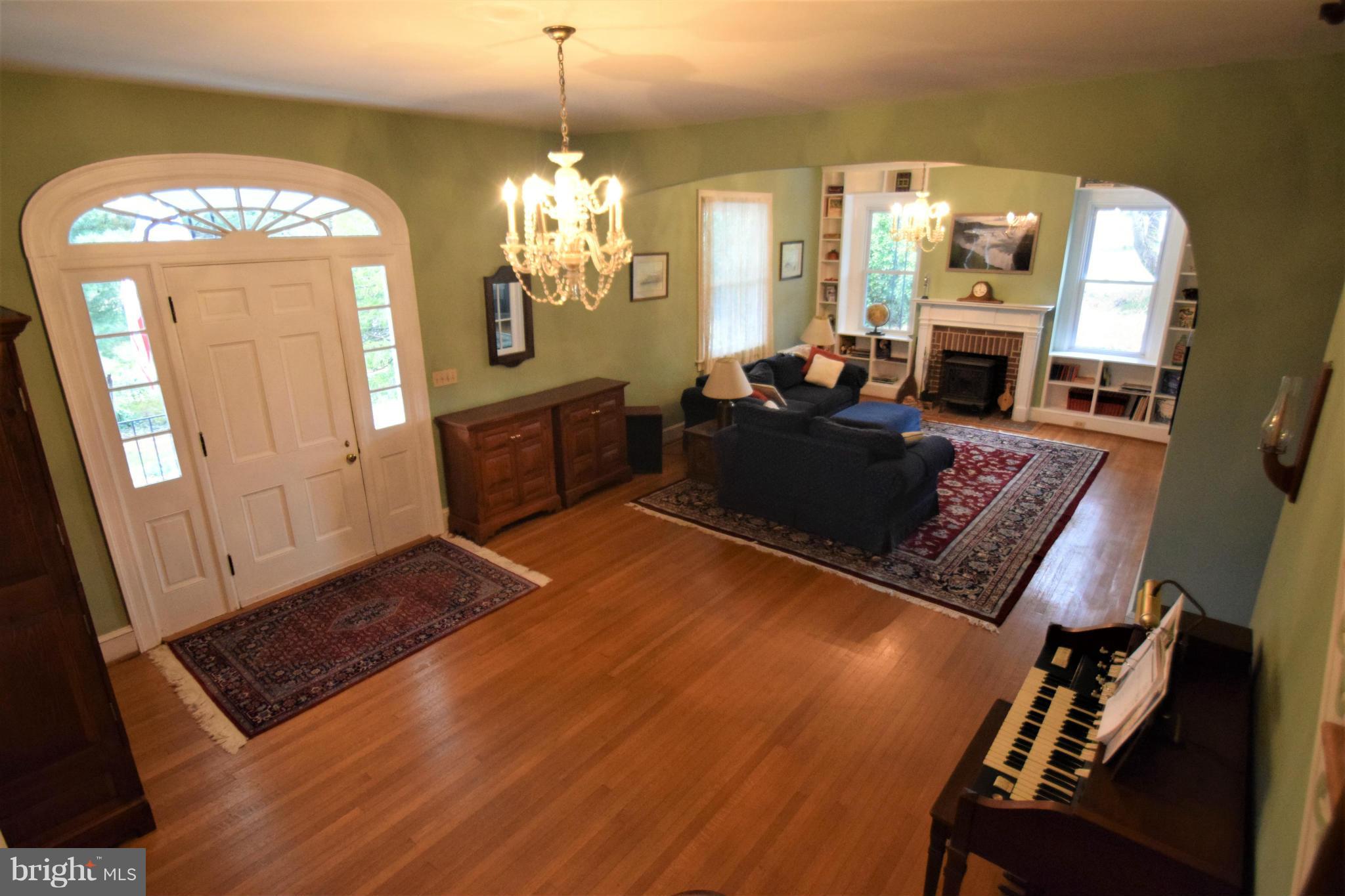 601 Charing Cross Road Baltimore, MD 21229 - Photo 8 of 30 a living room with furniture and a chandelier