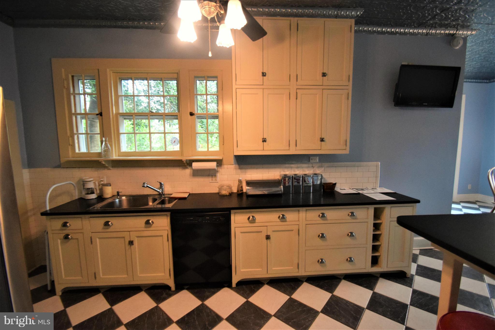 601 Charing Cross Road Baltimore, MD 21229 - Photo 10 of 30 a kitchen with a sink a stove and cabinets