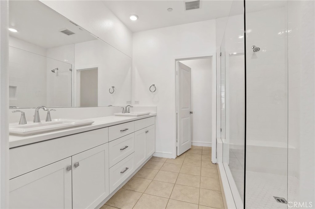 454 Palermo Lake Forest, CA 92630 - Photo 19 of 44 a bathroom with a granite countertop sink mirror and a