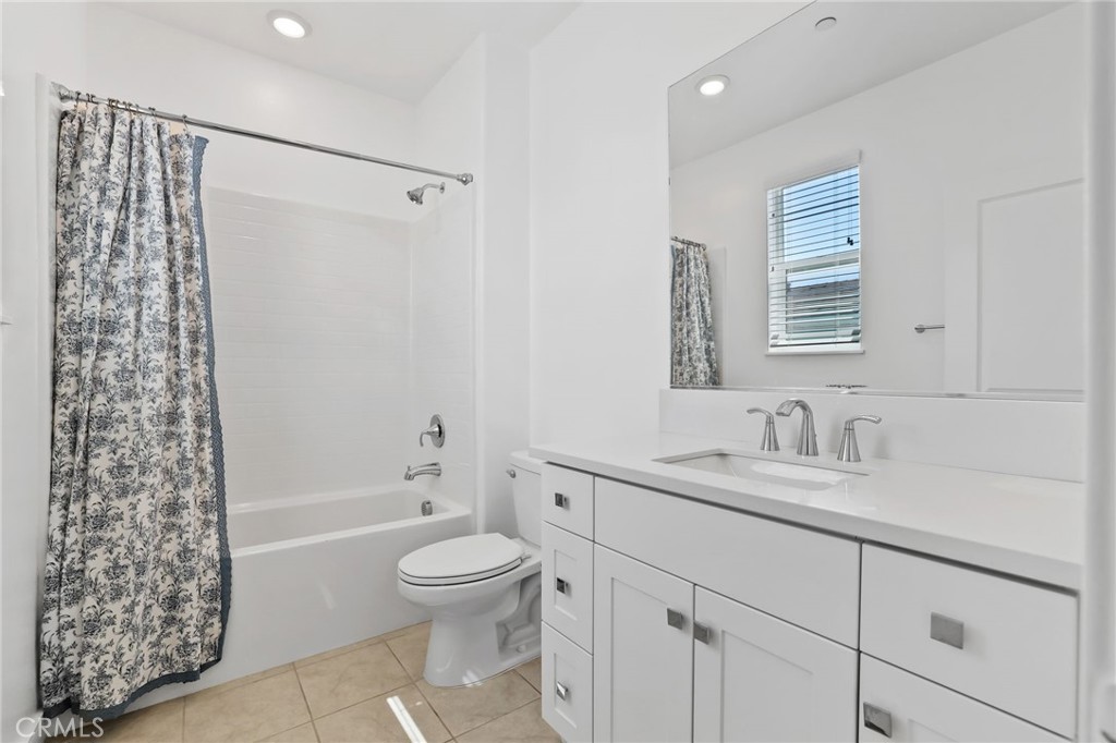 454 Palermo Lake Forest, CA 92630 - Photo 24 of 44 a bathroom with a sink a toilet and shower