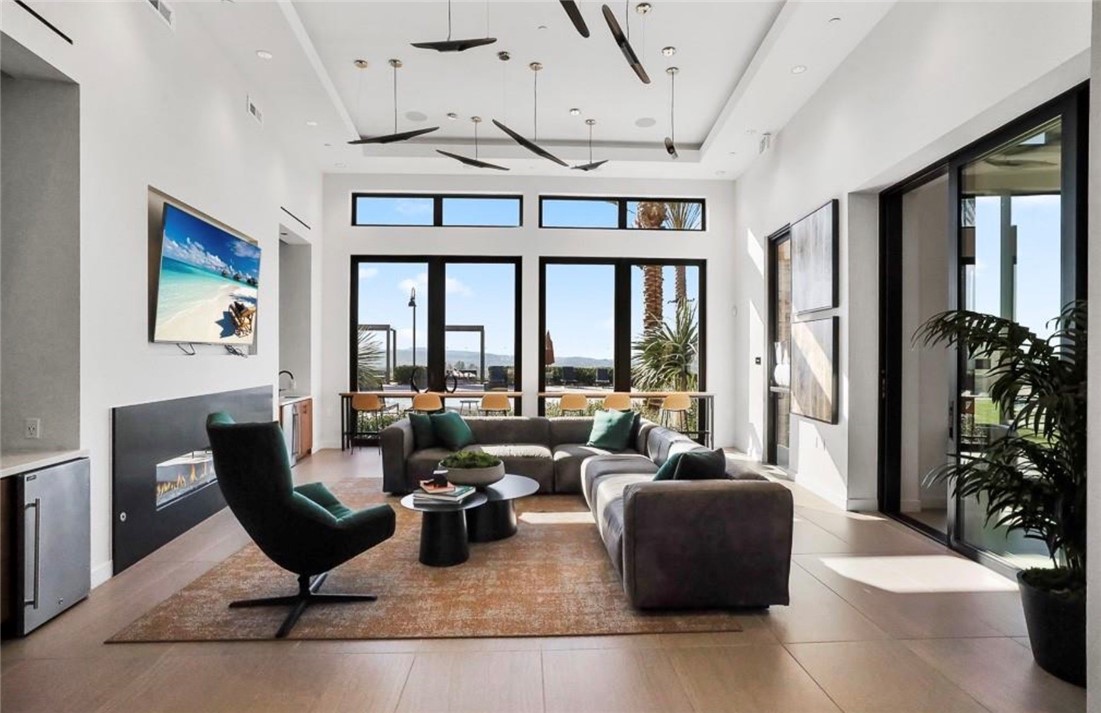 454 Palermo Lake Forest, CA 92630 - Photo 37 of 44 a living room with furniture ceiling fan and a large window