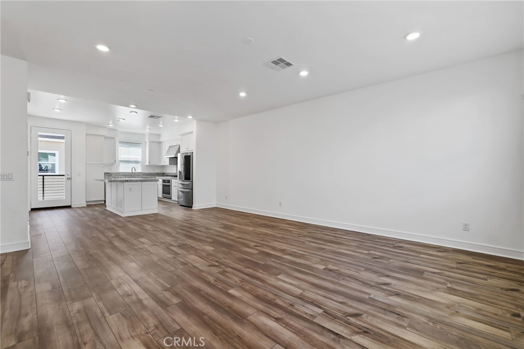 454 Palermo Lake Forest, CA 92630 - Photo 4 of 44 a view of a kitchen with a sink and a refrigerator