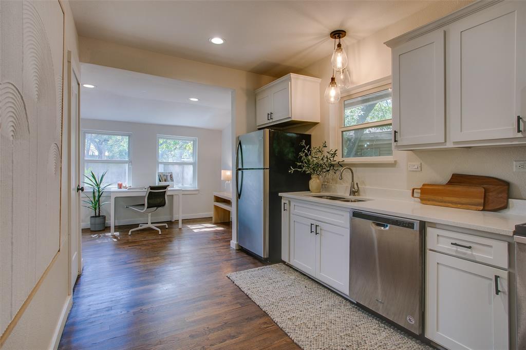 2606 West 12th Street Dallas, TX 75211 - Photo 19 of 36 a kitchen with refrigerator and window