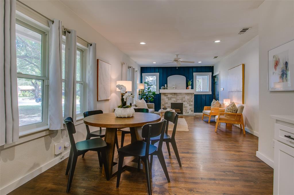 2606 West 12th Street Dallas, TX 75211 - Photo 25 of 36 a view of a dining room with furniture window and wooden floor