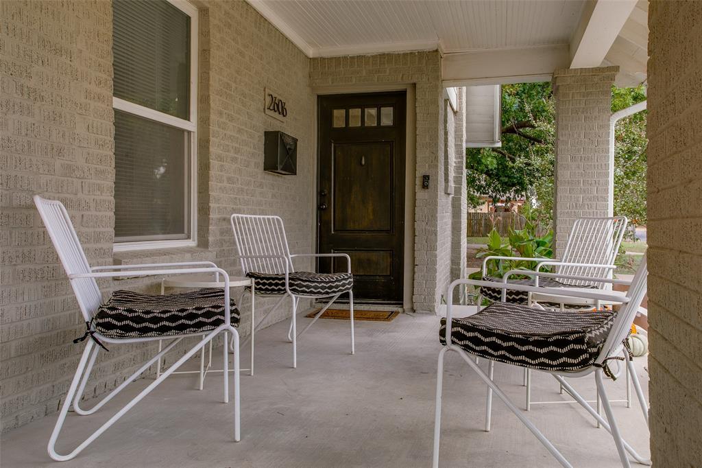 2606 West 12th Street Dallas, TX 75211 - Photo 6 of 36 a outdoor dining space with furniture and a potted plant