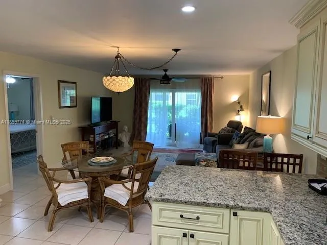 a kitchen with a table and chairs in it