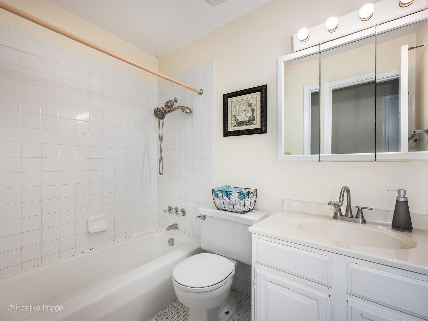 2407 South Goebbert Road, Unit G202 Arlington Heights, IL 60005 - Photo 15 of 17 a bathroom with a sink toilet and shower