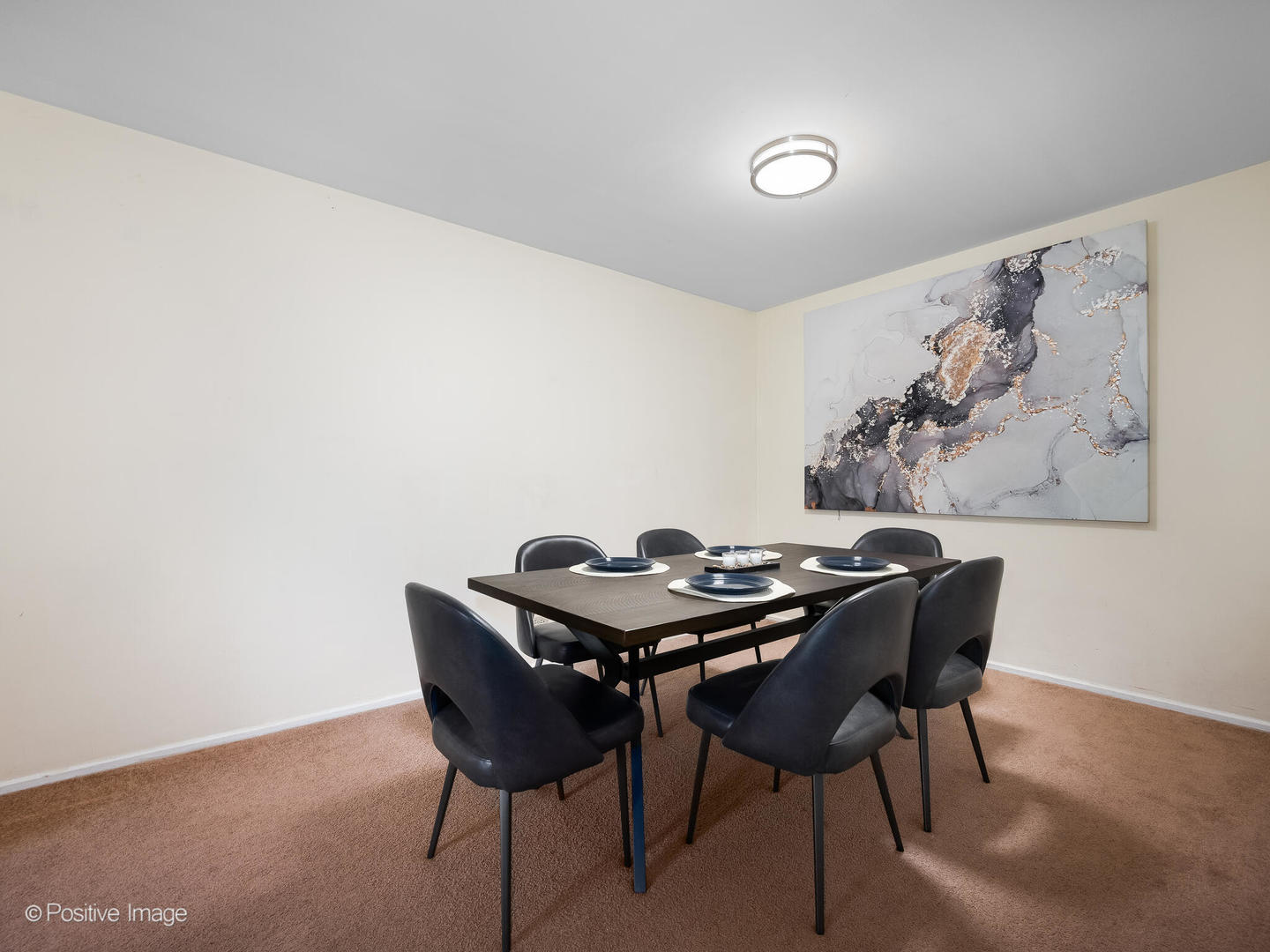 2407 South Goebbert Road, Unit G202 Arlington Heights, IL 60005 - Photo 5 of 17 a dining room with furniture and wooden floor