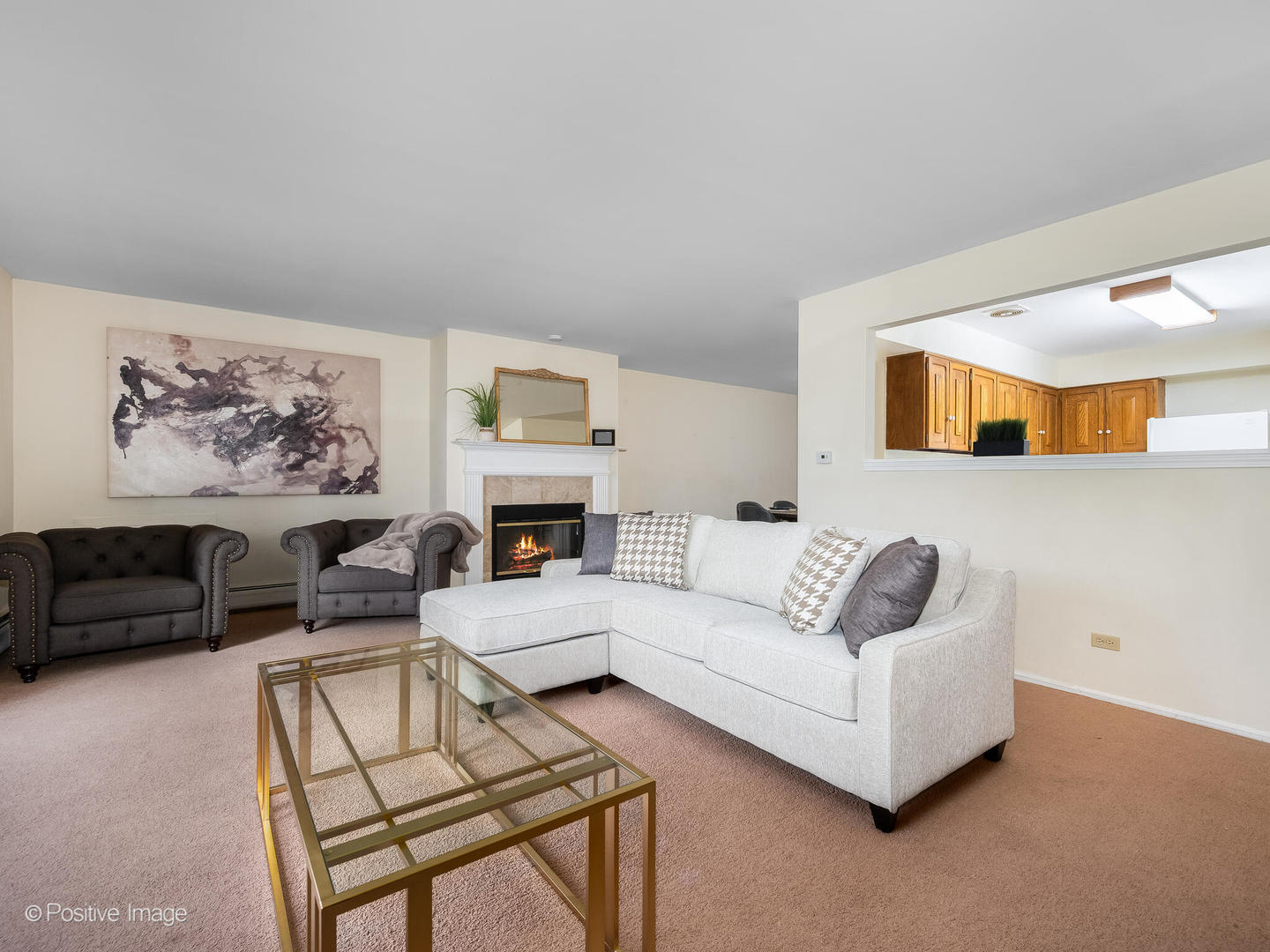 2407 South Goebbert Road, Unit G202 Arlington Heights, IL 60005 - Photo 8 of 17 a living room with furniture and a fireplace