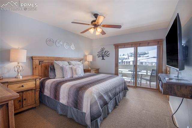 710 Gothic Road, Unit 1 Crested Butte, CO 81225 - Photo 16 of 25 Carpeted bedroom featuring ceiling fan and access to outside