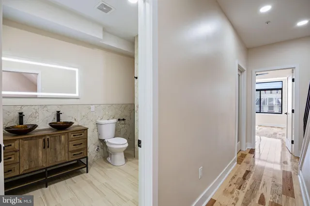 a bathroom with a toilet a sink and bathtub
