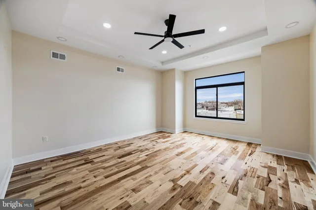 a bed room with bed and a chandelier