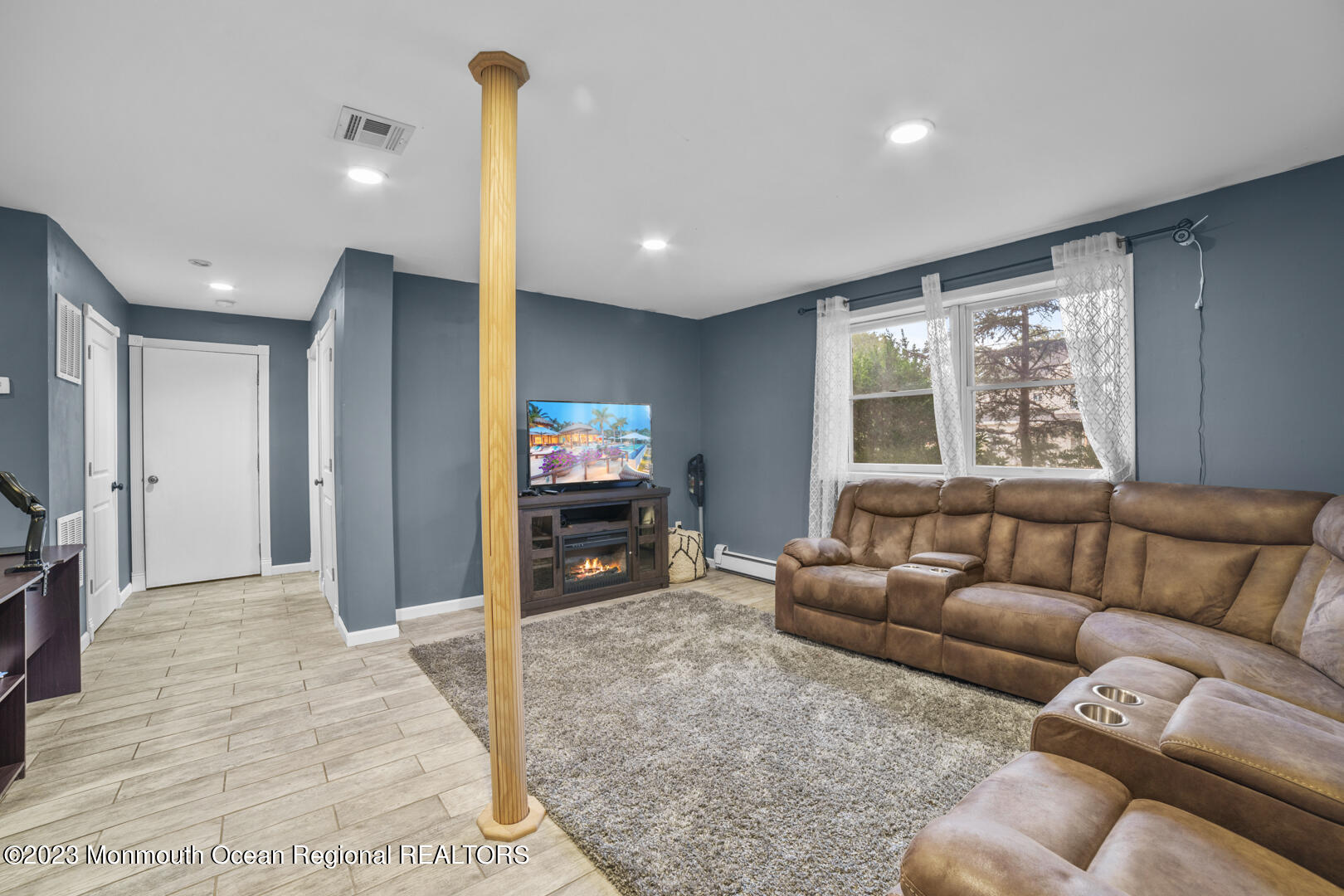 47 Forest Drive Jackson, NJ 08527 - Photo 12 of 17 a living room with furniture window and a flat screen tv