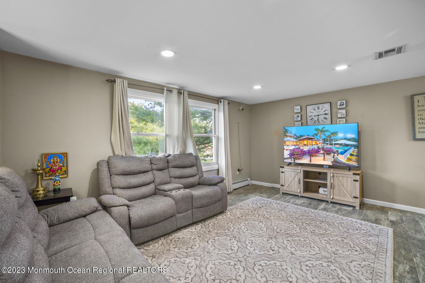 47 Forest Drive Jackson, NJ 08527 - Photo 6 of 17 a living room with furniture and a flat screen tv