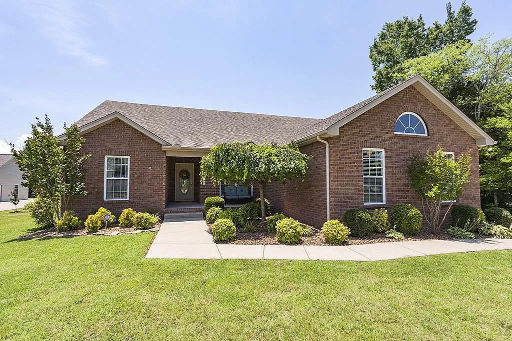 827 Oslo Road Mount Juliet, TN 37122 - Photo 1 of 25 a front view of a house with a yard and garage