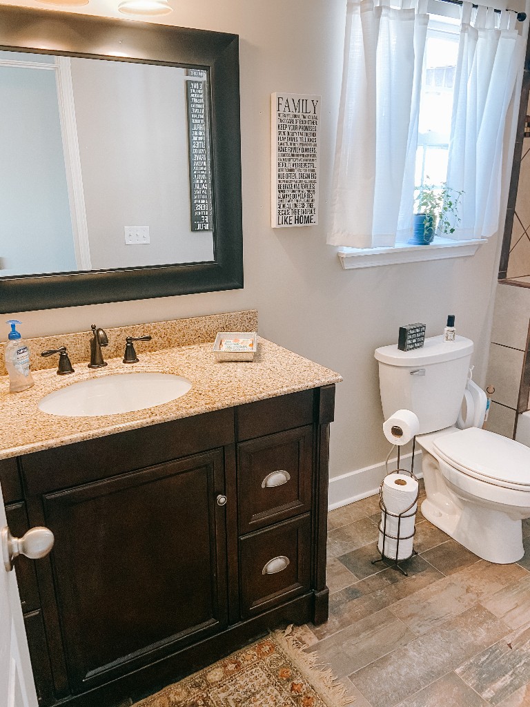827 Oslo Road Mount Juliet, TN 37122 - Photo 18 of 25 a bathroom with a toilet sink and mirror